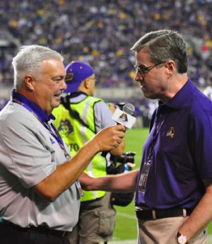 Brian Bailey interviews new ECU Chancellor Dr. Cecil Staton during a break in the action at Saturday night's game. (Bonesville Staff photo)
