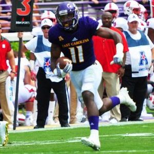 ECU all-purpose player James Summers heads towards one of the two touchdowns he scored last Saturday in the Pirates' win over N.C. State. (Bonesville Staff photo)