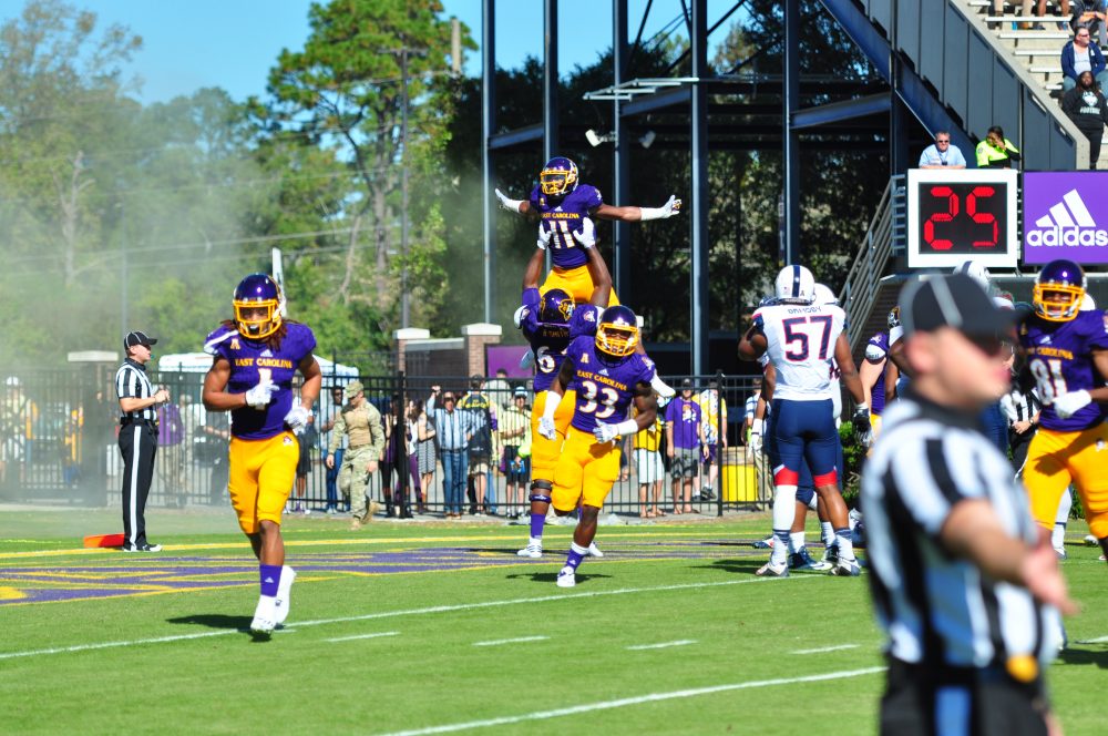 The Pirates were flying high after a 41-3 homecoming win over UCONN, much like James Summers (11) after putting the Pirates on the board in their opening drive (Bonesville Staff photo)