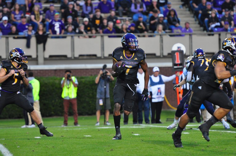 Zay Jones looks for the edge on a shovel pass from quarterback Gardner Minshew. The senior receiver had 212 yards on 12 catches with two touchdowns on his record-breaking night. (Bonesville Staff)