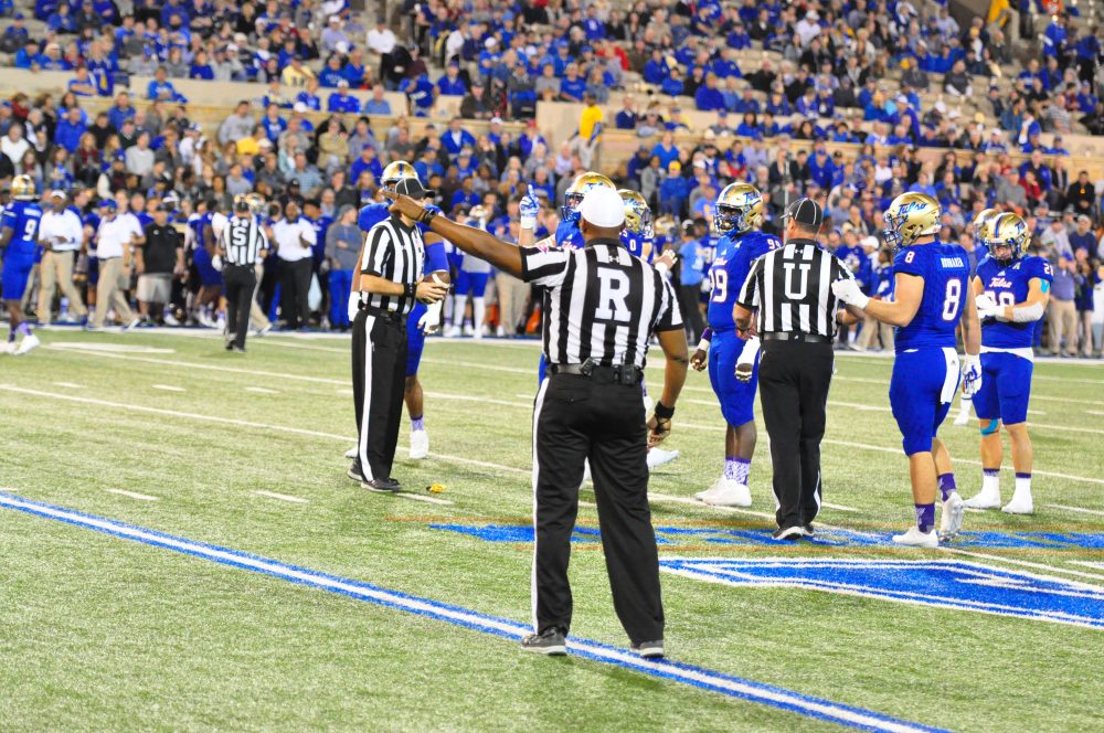 Referee Tracy Jones indicates a penalty against East Carolina, one of may infractions the Pirates committed in their 45-24 road loss to American Athletic Conference foe Tulsa on Saturday night, Nov. 5, 2016. (Photo by Al Myatt)