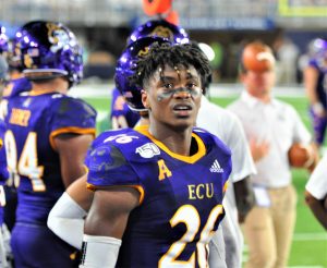 East Carolina defensive back Colby Gore checks out a replay on the big screen. (Photo by Al Myatt)