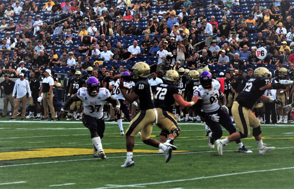 Navy quarterback Malcolm Perry (10), shown throwing deep, accounted for six touchdowns on Saturday