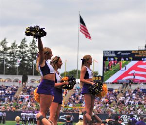 Pirate cheerleaders lend their support as Old Glory flies at Navy-Marine Corps Memorial Stadium