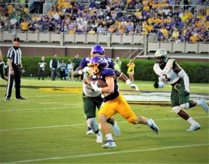 Tyler Snead runs for East Carolina after taking an inside pitch on Saturday night at Dowdy-Ficklen Stadium (Photo by Al Myatt)