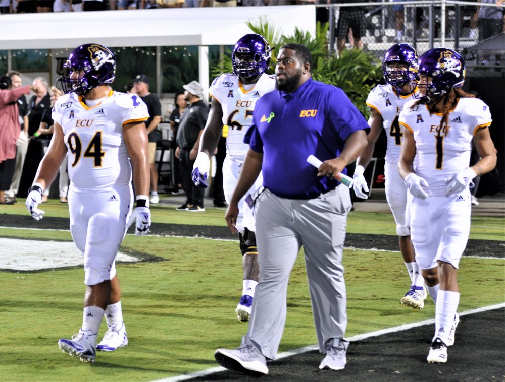 ECU captains come out before kickoff. From left are Alex Turner, D'Ante Smith, Kendall Futrell and Deondre Farrier (Al Myatt photo)