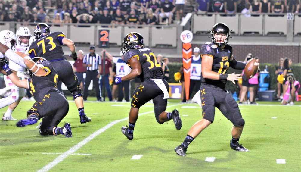 ECU sophomore quarterback Holton Ahlers sets to deliver a pass on Thursday night. (Photo by Al Myatt)