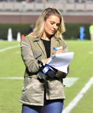CBS Sports Network sideline reporter Amanda Balionis makes notes during halftime (Al Myatt photo)