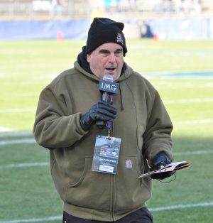 Sideline reporter Marty Feurer of the Pirate radio netork was dressed for a chilly day in East Hartford. (Photo by Al Myatt)
