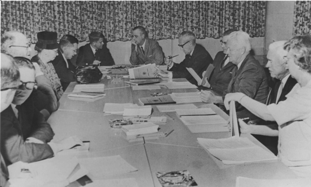 While in the state legislature, Morgan became the first alumnus to serve on the East Carolina Board of Trustees. This photo (ca. 1964) from The Buccaneer is of one of the meetings of the Board of Trustees. (Left to right): two unidentified men, Henry Oglesby, Mrs. Belk, unidentified man, Robert Morgan, Leo Jenkins, William Blount, unidentified man, Fred Bahnson, Irving Carlyle and Agnes Barrett. (ECU Archives Photo)