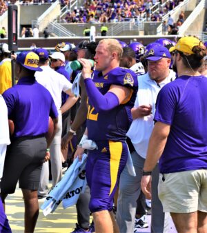 Holton Ahlers stays hydrated on a sunny Saturday at Dowdy-Ficklen Stadium.
