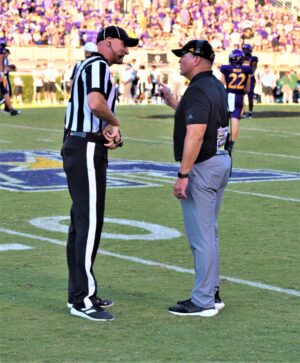 East Carolina coach Mike Houston wants an explanation on an offensive pass interference call. (Al Myatt photo)