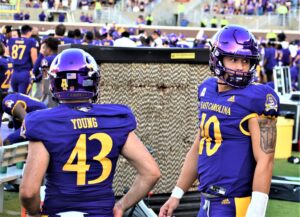 Jonn Young punted just once Saturday. Mason Garcia (right) came in to throw a touchdown pass in the fourth quarter. (Al Myatt photo)